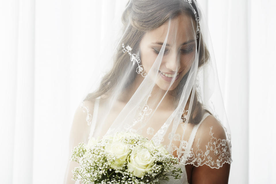 Woman in veil wedding bride represents virginity