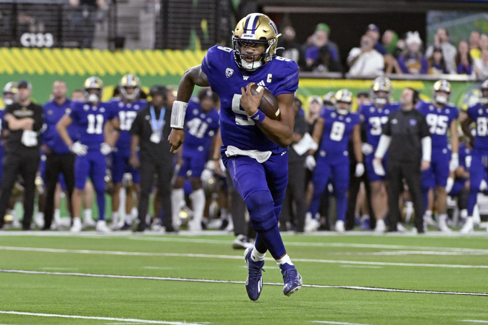 Washington quarterback Michael Penix Jr. carries against Oregon during the second half of the Pac-12 championship NCAA college football game Friday, Dec. 1, 2023, in Las Vegas. (AP Photo/David Becker)