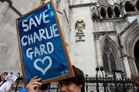 People campaign to show support for allowing Charlie Gard to travel to the United Stated to receive further treatment, outside the High Court in London, Britain July 13, 2017. REUTERS/Peter Nicholls