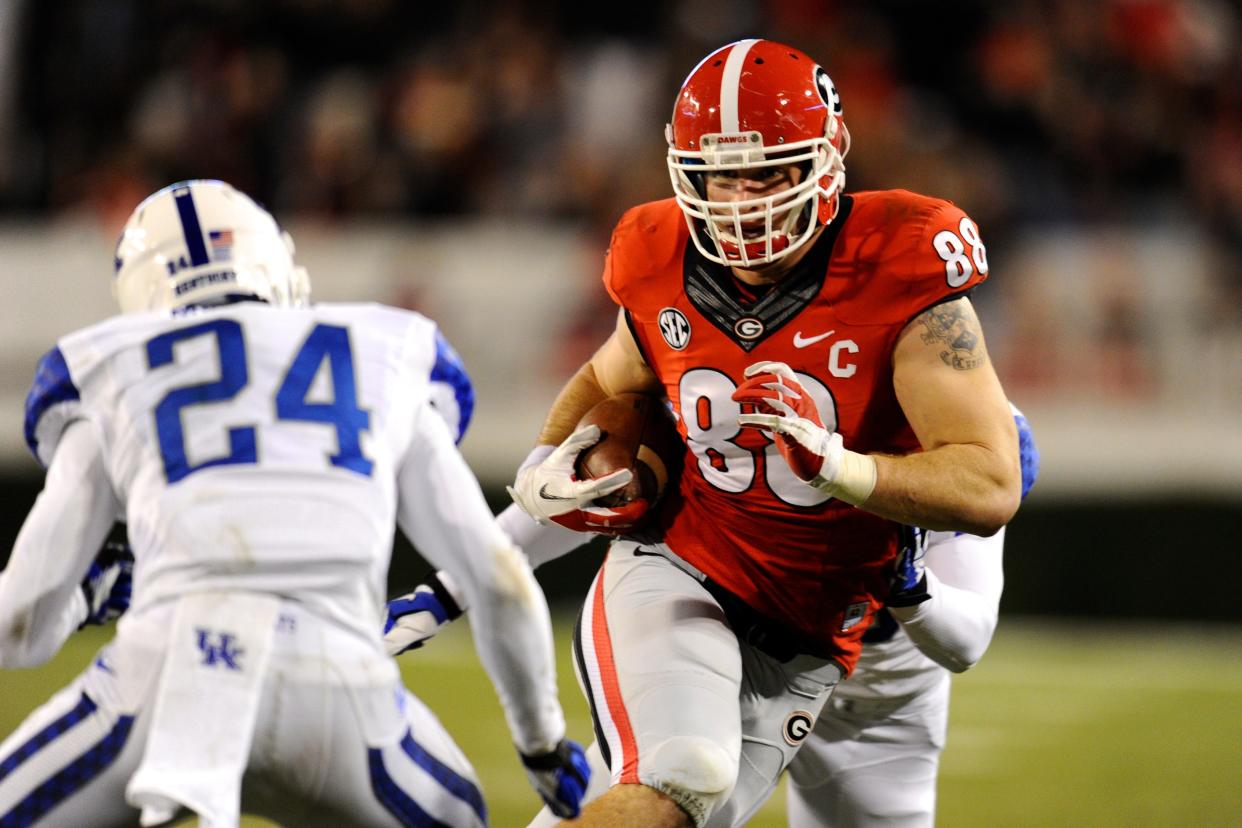 Nov 23, 2013; Athens, GA, USA; Georgia Bulldogs tight end Arthur Lynch (88) runs against Kentucky Wildcats defensive back Blake McClain (24) during the second half at Sanford Stadium. Georgia defeated Kentucky 59-17. Mandatory Credit: Dale Zanine-USA TODAY Sports