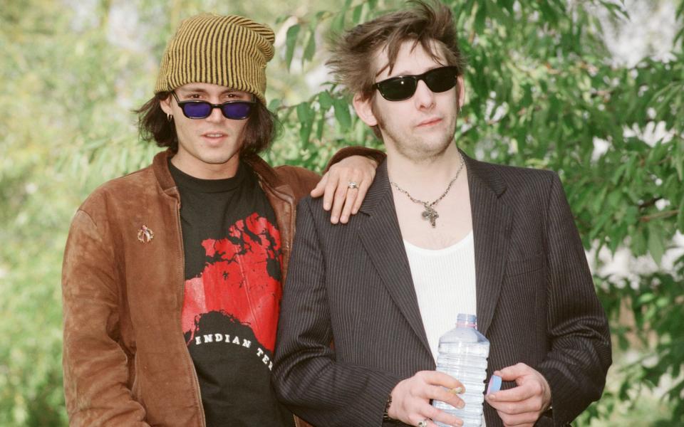 With his friend Johnny Depp, who made a guest appearance on MacGowan's first solo album, The Snake, in 1994