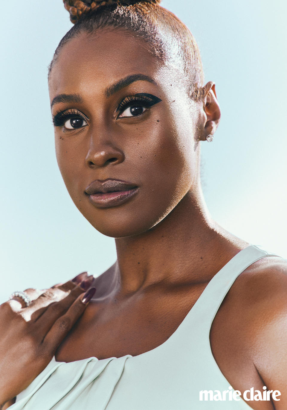 Issa Rae in JW Anderson dress; Audrey Nicole Diamonds & Jewelry ring and earrings.