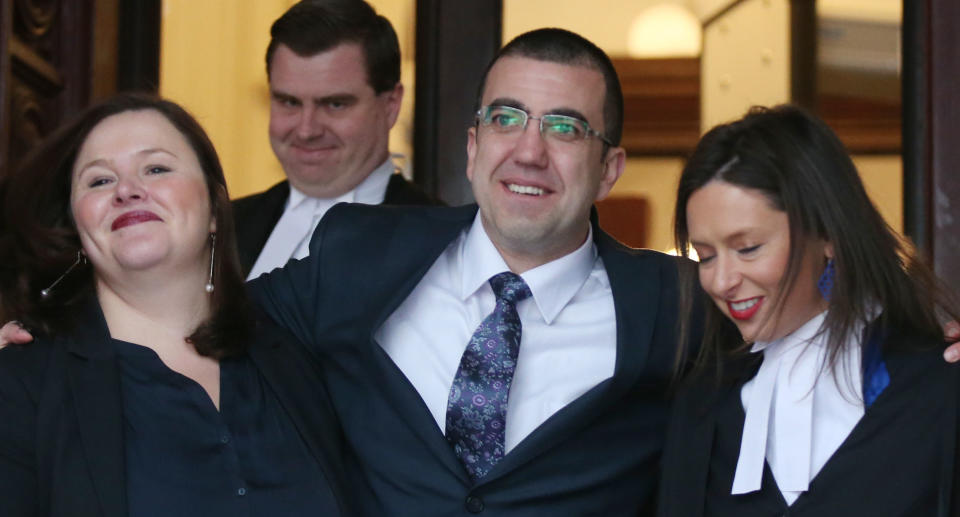 Faruk Orman (second right), acquitted of the murder of underworld figure Victor Peirce, with legal team Ruth Parker (left), Paul Smallwood (second left) and Carly Marcs Lloyd (right) leave the court of appeal in Melbourne, Friday, July 26, 2019. 