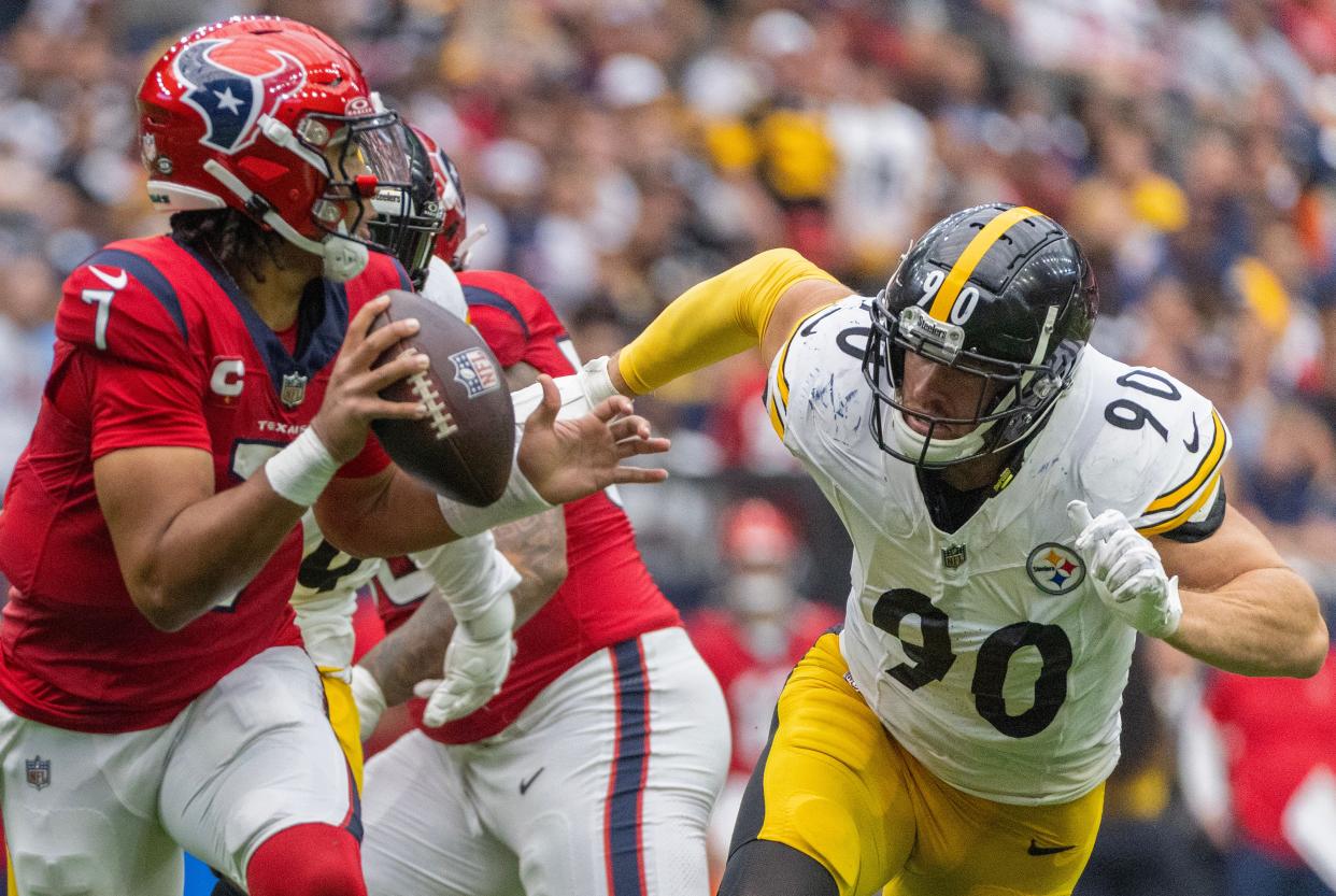 Texans quarterback C.J. Stroud (7) is chased by Pittsburgh Steelers linebacker T.J. Watt (90) in their Oct. 1 meeting, which was won by Houston.