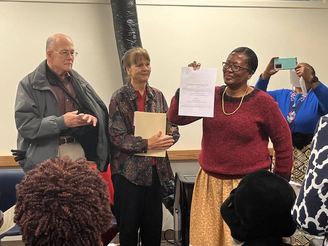 James and Carolyn Parsley gave about an acre of land believed to contain a slave burial ground to Beverly Scarlett, right, who aims to preserve the cemetery through the nonprofit Indigenous Memories. A deed conveying ceremony was held at the Orange County Register of Deeds in Hillsborough, N.C. on December 13, 2022.