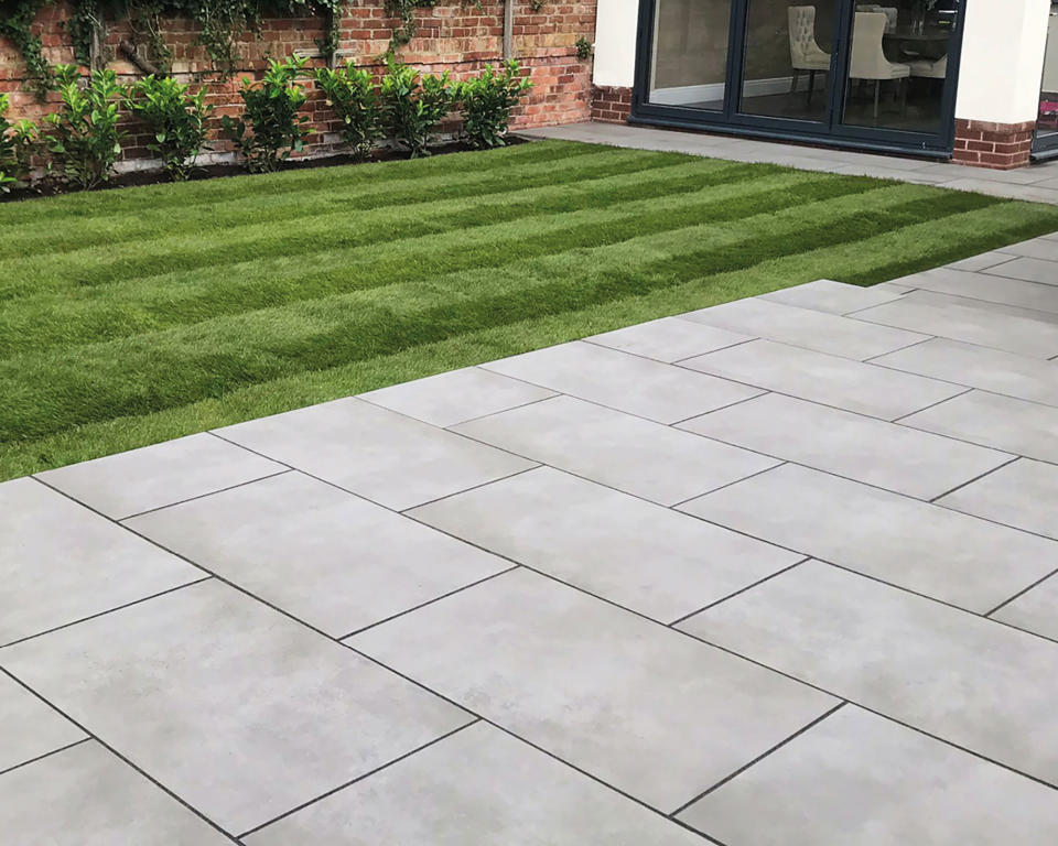 7. Use your patio to edge two sides of a lawn