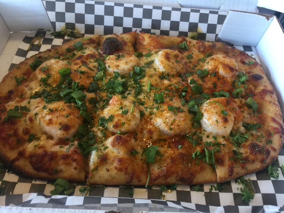 The Trap Pizza from The Missing Brick features Chef Oya's OG Garlic Herb Trap Buttah and FoodLoveTog's Young Bae Spice.