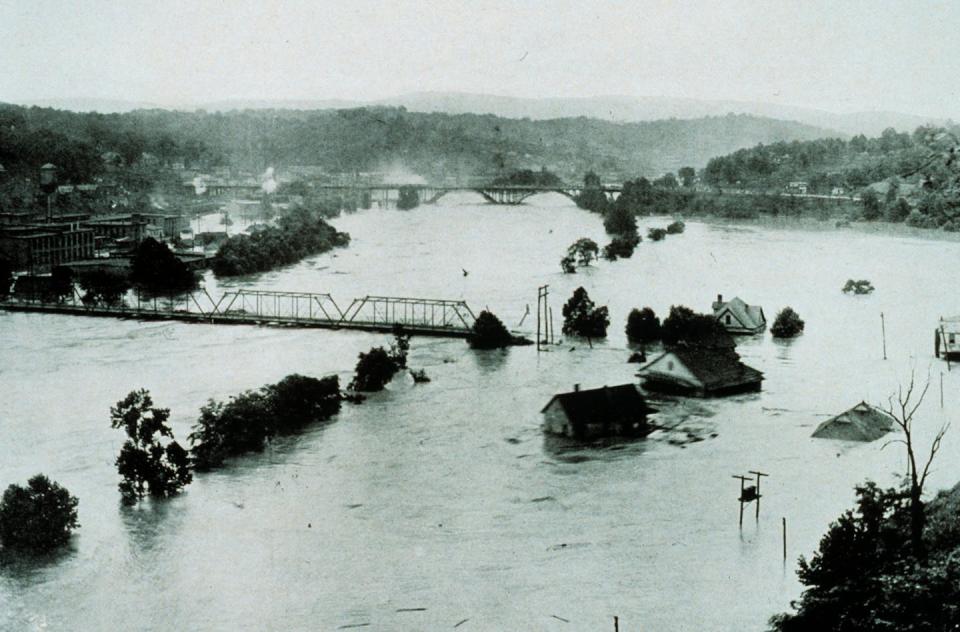 The French Broad River spread far beyond its banks, wiping out railroad tracks and inundating neighborhoods and factories during the storms in 1916. <a href="https://photolib.noaa.gov/Collections/National-Weather-Service/Meteorological-Monsters/Floods/emodule/645/eitem/3059" rel="nofollow noopener" target="_blank" data-ylk="slk:Archival Photography by Steve Nicklas/NOAA;elm:context_link;itc:0;sec:content-canvas" class="link ">Archival Photography by Steve Nicklas/NOAA</a>