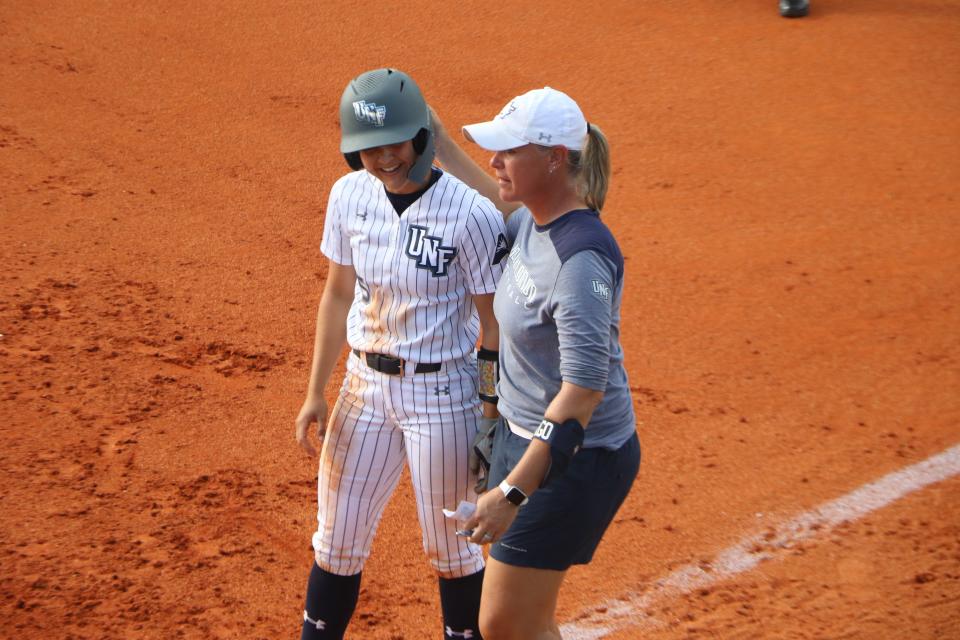 Marcie Higgs (right) coached the University of North Florida for 14 years and led the Ospreys to a school-record tying 42 victories this season.