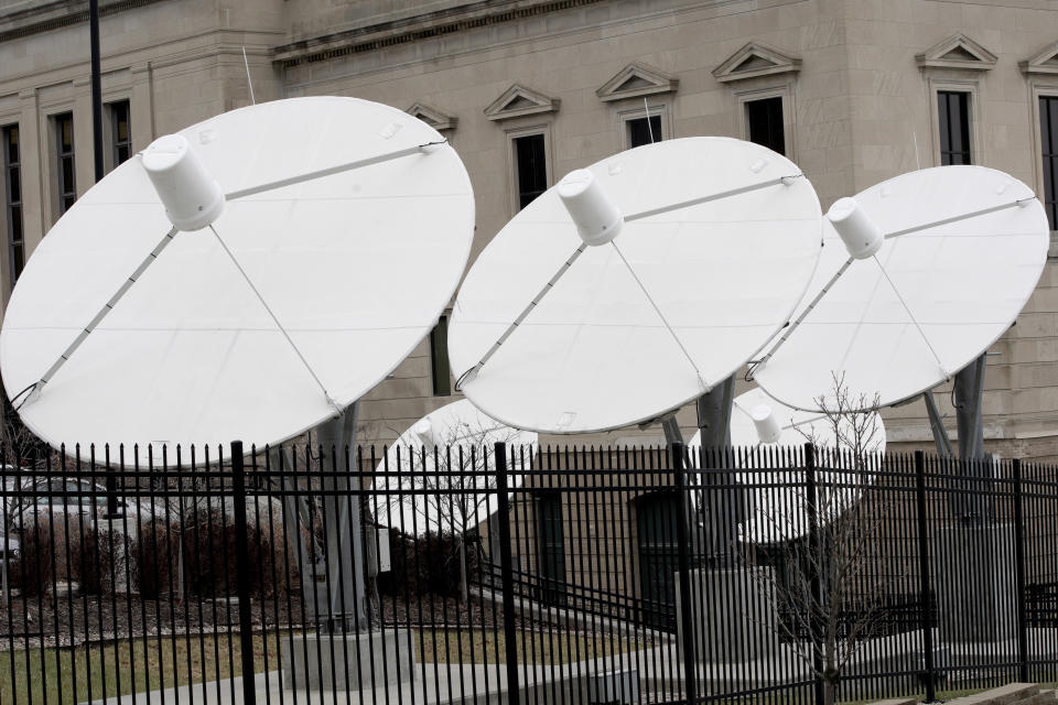 In this Nov. 21, 2019 photo, satellite dishes are seen on the property of KETV, an ABC-affiliated television station in Omaha, Neb. An estimated 500,000 households nationwide don't have access to local broadcast channels because of a complicated federal law and a decades-long dispute between local broadcasters and satellite television providers. Households in the nation's "neglected markets" _ rural areas that can't get local broadcast signals, are forced to rely on satellite service with news from other states. (AP Photo/Nati Harnik)