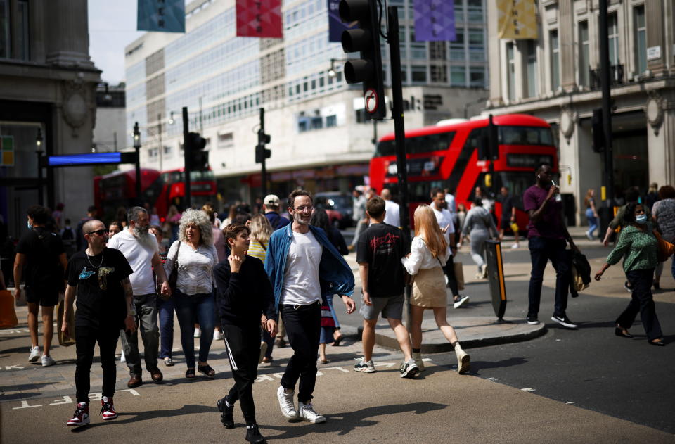 UK retail  People walk along Oxford Street, amid the coronavirus disease (COVID-19) outbreak, in London, Britain, July 26, 2021. REUTERS/Henry Nicholls