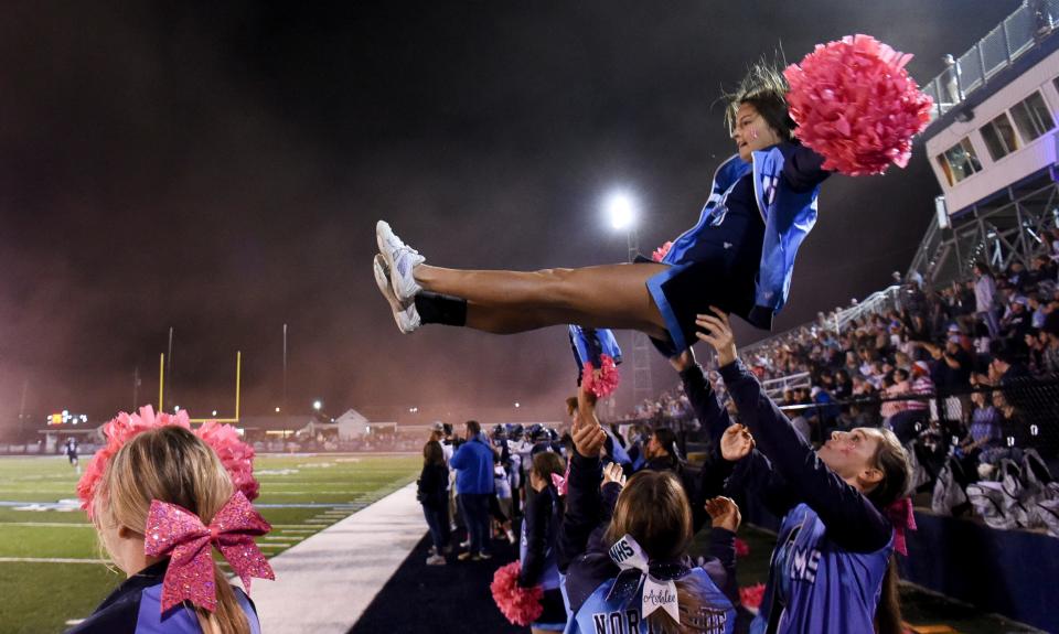 Oct 28, 2022; Samantha, AL, USA; Kadyn Colee  flies as her teammates catch her as they cheer Friday, Oct. 28, 2022 at Northside High School. 