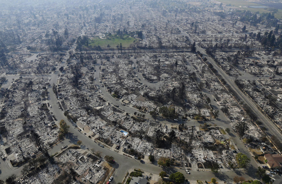 <p>Homes burned by a wildfire are seen Wednesday, Oct. 11, 2017, in Santa Rosa, Calif. (Photo: Jeff Chiu/AP) </p>