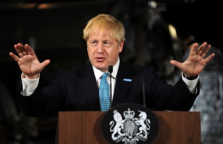 Britain's Prime Minister Boris Johnson gestures during a speech on domestic priorities at the Science and Industry Museum in Manchester