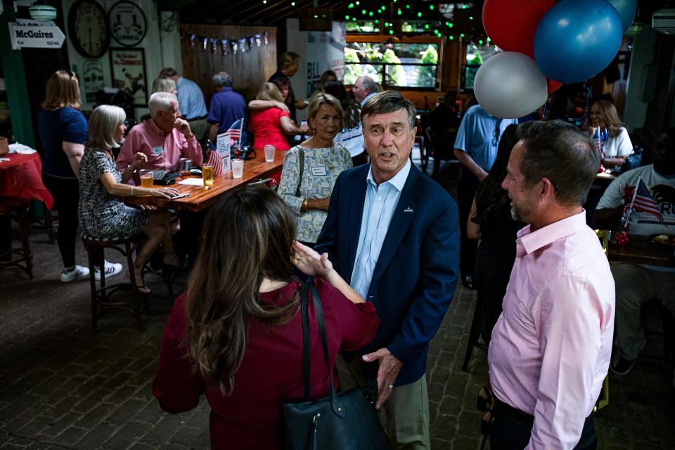 Jeffersontown mayor and Louisville republican mayoral candidate Bill Dieruf talks with supporters at his watch party at O'Shea's Irish Pub on Baxter Ave. May 17, 2022