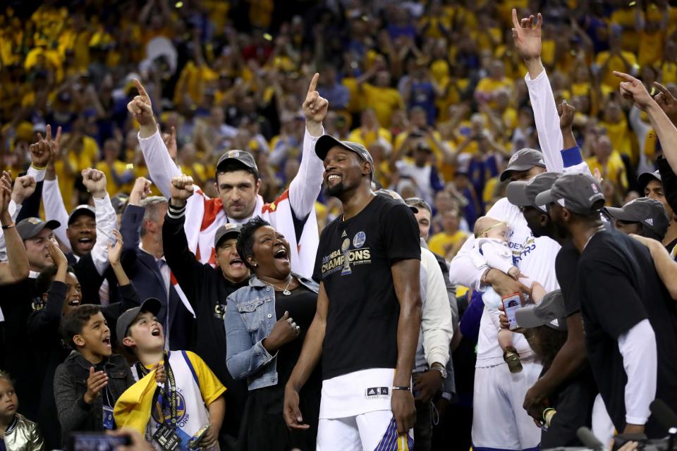 <p>Kevin Durant #35 of the Golden State Warriors celebrates with his mother Wanda after being named Bill Russell NBA Finals Most Valuable Player after defeating the Cleveland Cavaliers 129-120 in Game 5 to win the 2017 NBA Finals at ORACLE Arena on June 12, 2017 in Oakland, California. </p>