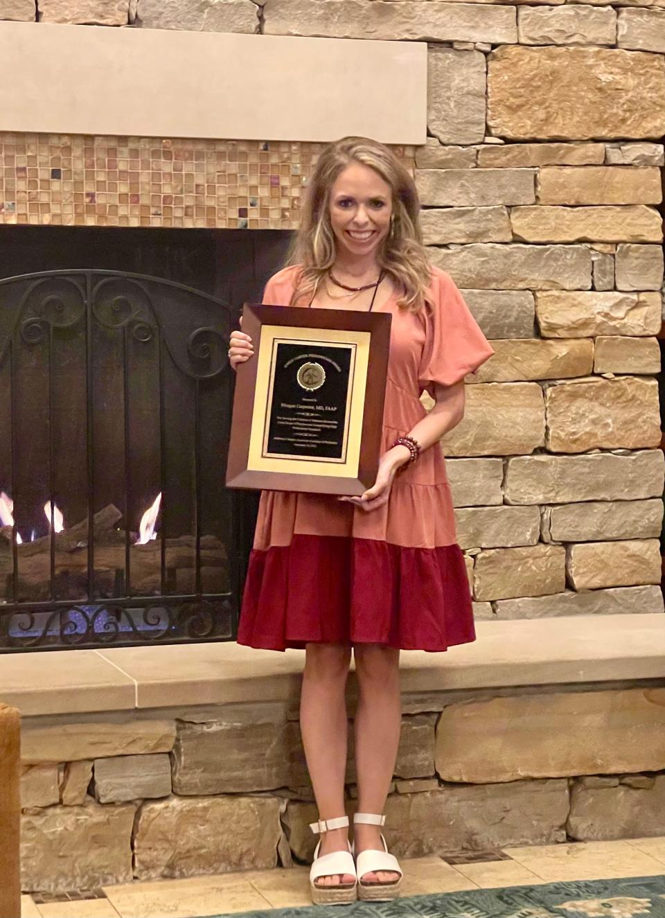 Dr. Meagan Carpenter holds the 2022 Alabama Chapter of the American Academy of Pediatrics Early Career Physician Award.
