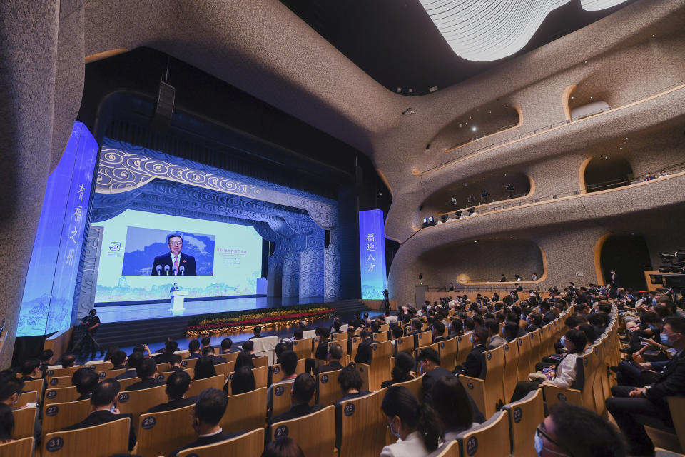 In this photo released by Xinhua News Agency, Vice Minister of Education Tian Xuejun, who is also Director of the Chinese National Commission for UNESCO delivers his opening speech on a screen during the opening ceremony of the 44th session of the World Heritage Committee of UNESCO in Fuzhou in southeast China's Fujian Province on Friday, July 16, 2021. The Chinese host of this year's meeting of the U.N, World Heritage Committee defended on Sunday, July 18, the body's proposal to label the Great Barrier Reef as "in danger" against Australian government suspicion that China influenced the finding for political reasons. Tian Xuejun said Australia should attach importance to the opinions of advisory bodies instead of making groundless accusations. (Song Weiwei/Xinhua via AP)