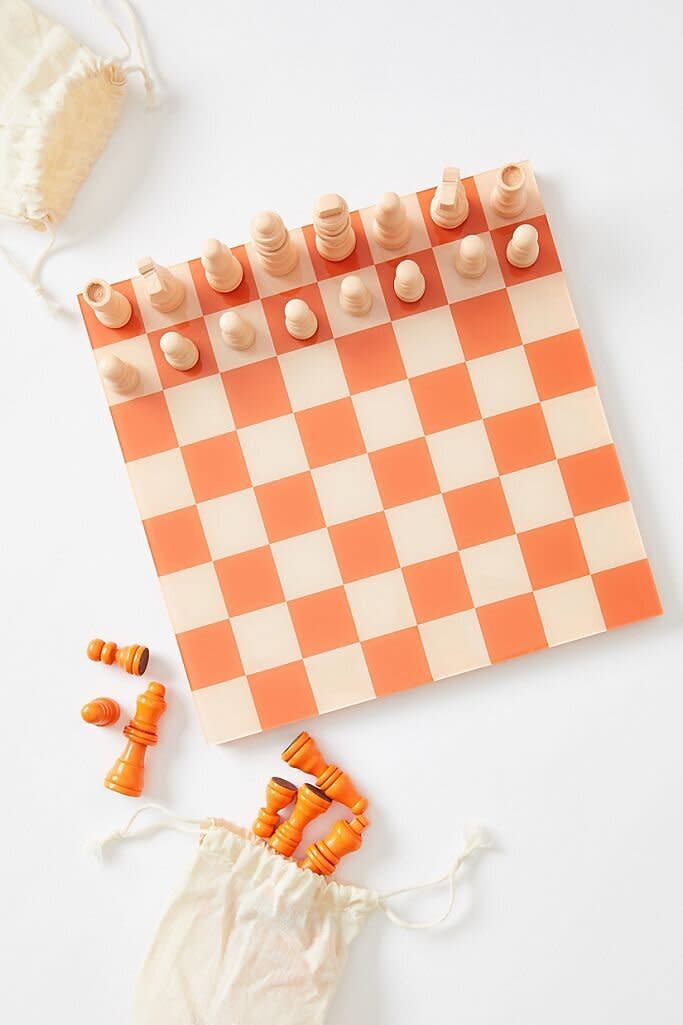 This chess set comes with a plexiglass board and wooden game pieces, mixing in the traditional with the modern. Now, get your knights in order. <a href="https://fave.co/3lKrw2B" target="_blank" rel="noopener noreferrer">Find it for $58 at Anthropologie</a>. You can also get it in <a href="https://fave.co/3mCjZnB" target="_blank" rel="noopener noreferrer">green at Urban Outfitters</a>. 