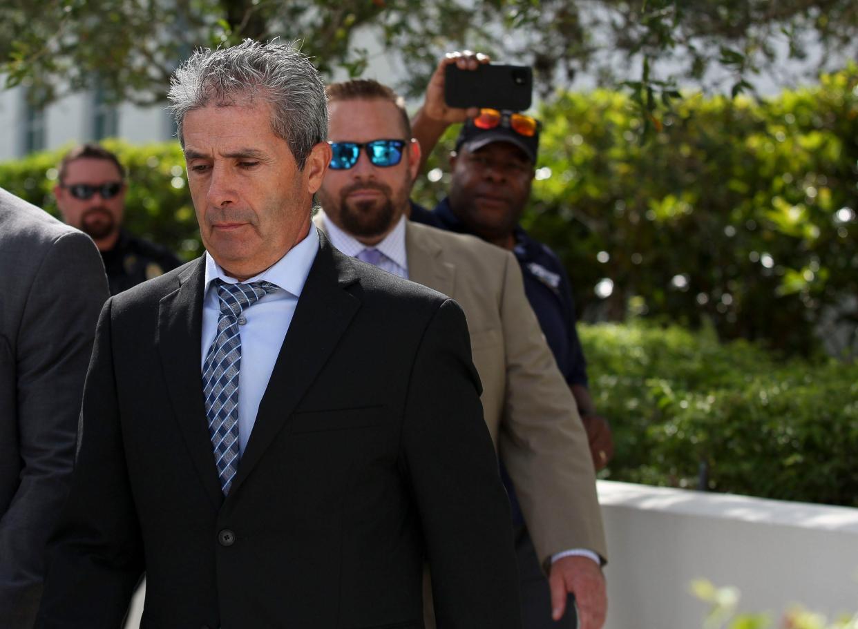 Former President Donald Trump's codefendant Carlos De Oliveira exits the Alto Lee Adams Sr. U.S. Courthouse on Tuesday, Aug. 15, 2023, after entering pleas of not guilty to criminal charges in the classified documents case.