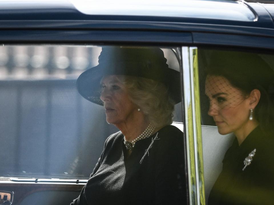 Camilla, Queen Consort and Kate Middleton, Princess of Wales are driven behind the coffin of Queen Elizabeth II.