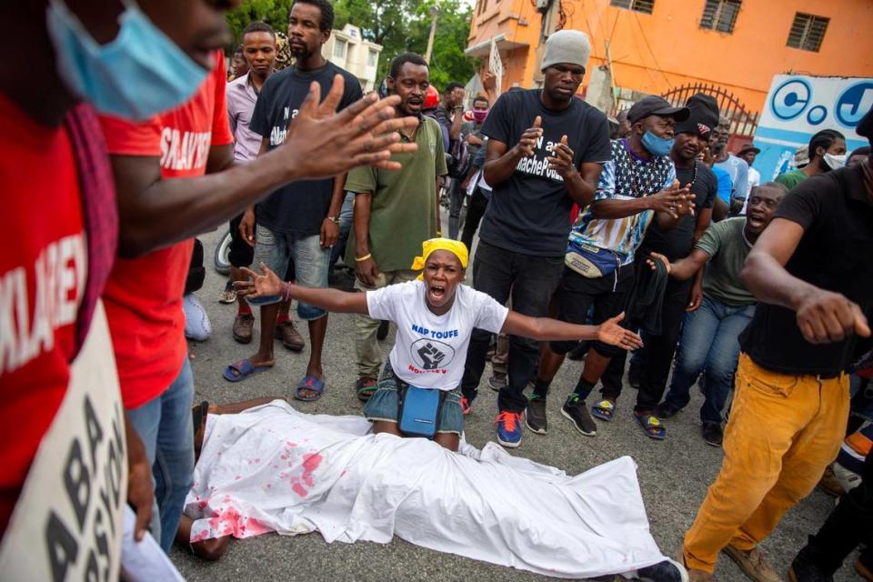 Protesters perform a kidnapping sequence during a protest in Port-au-Prince, Haiti, Thursday, Dec. 10, 2020. Port-au-Prince has seen an increase in gang violence and kidnappings while the government has proven to be incapable of controlling it.