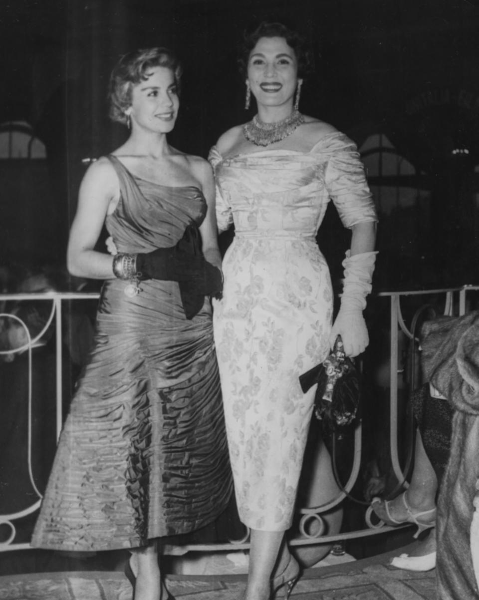 Actresses Lilia Prado and Taheyya Kariokka wearing evening gowns as they attend the Cannes Film Festival, France, May 1st 1956. (Photo by Keystone/Hulton Archive/Getty Images)