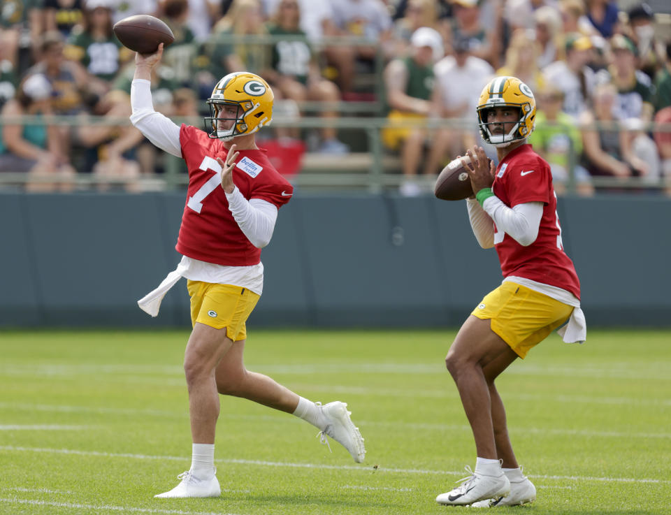 Green Bay Packers' quarterback Kurt Benkert (7) and quarterback Jordan Love (10) participate in passing drills during NFL football training camp Wednesday, July 28, 2021, in Green Bay, Wis. (AP Photo/Matt Ludtke)