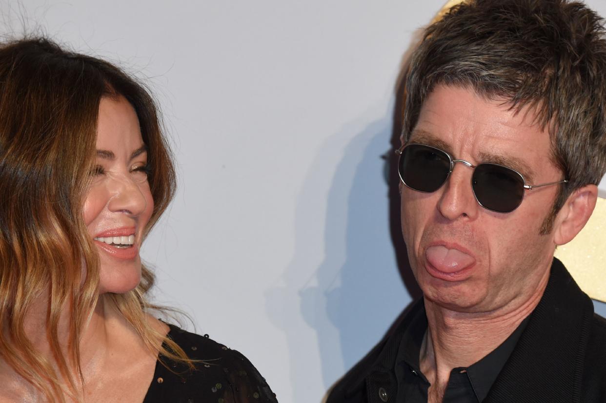 Noel Gallagher (R) and his ex-wife Sara MacDonald pose on the red carpet upon arrival for the UK premiere of the film 