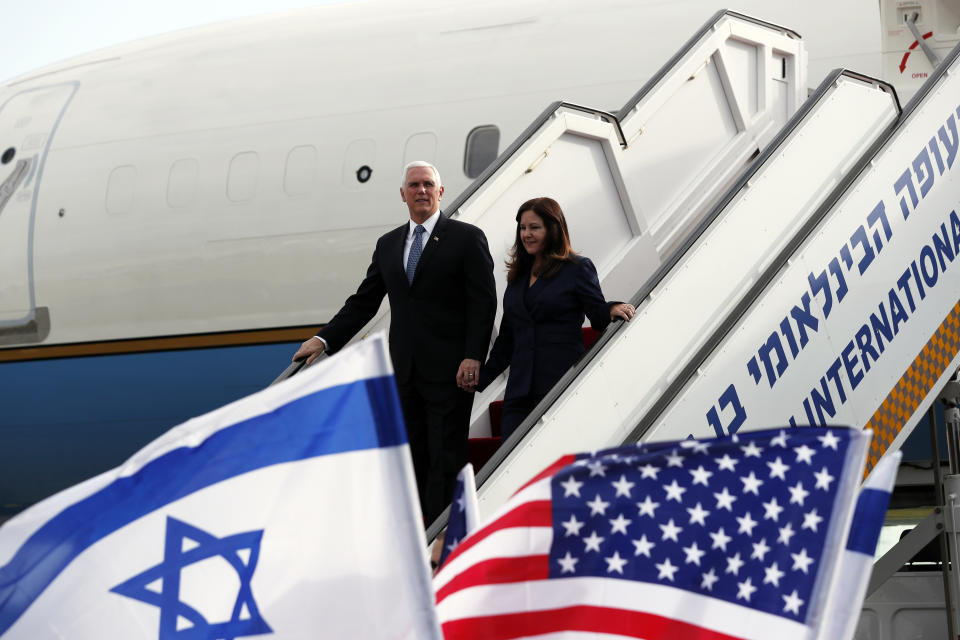 U.S. Vice President Mike Pence and his wife Karen disembark from a plane upon their arrival at Ben Gurion International Airport to attend the World Holocaust Forum at the Yad Vashem memorial centre, near Tel Aviv, Israel, Thursday, Jan. 23, 2020. (Ammar Awad/Pool Photo via AP)