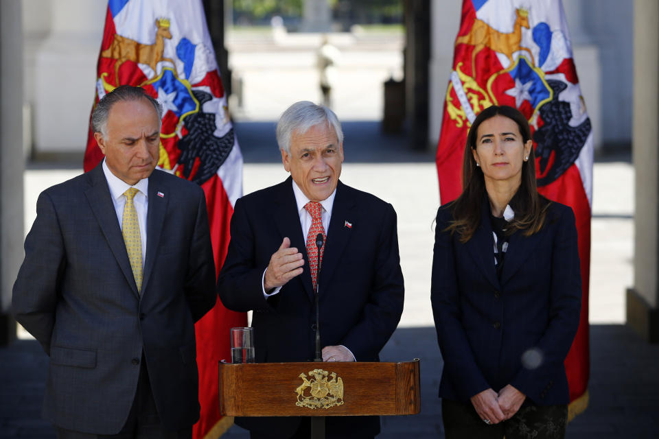 Chile's President Sebastian Pinera announces that he is calling off the Asia-Pacific Economic Cooperation Economic Forum, APEC, and Climate Change COP25 Conference, at La Moneda presidential palace in Santiago, Chile, Wednesday, Oct. 30, 2019. Pinera said that the ongoing protests have led him to call off the two major international summits that his country had been scheduled to host. (Ramon Monroy/ATON via AP)