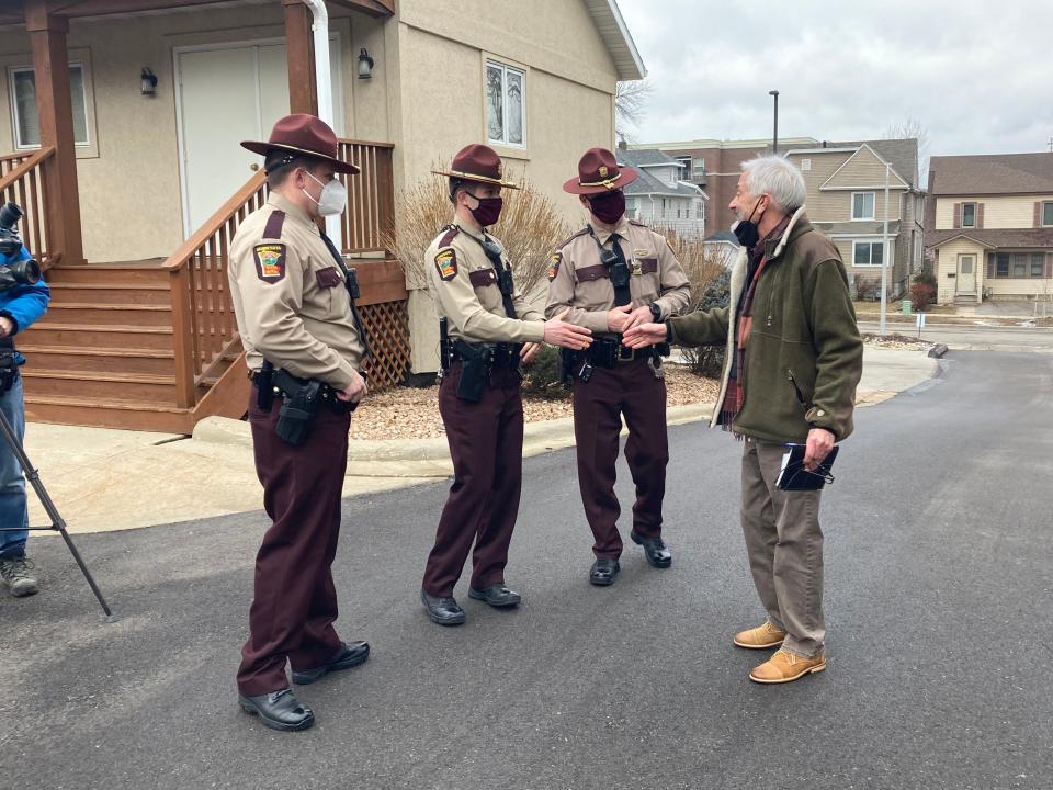 John Neuenschwander meeting with Minnesota state troopers and a lieutenant who transported a heart he needed for a transplant in October 2023. The group met on Jan. 2, 2024 after Neuenschwander recovered.