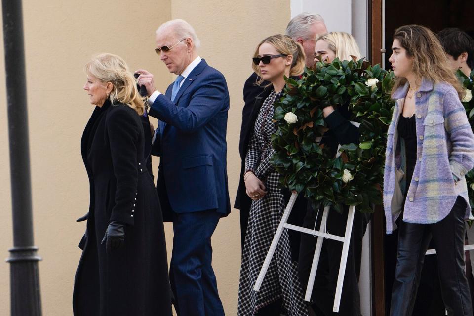 President Joe Biden and first lady Jill Biden followed by granddaughters Maisy Biden, carrying a wreath, Finnegan Biden and Natalie Biden, right, leave St. Joseph on the Brandywine Catholic Church in Wilmington, Del., after attending Mass on . Sunday marks the 50th anniversary of the car crash that killed Biden's first wife Neilia Hunter Biden and 13-month-old daughter Naomi Biden