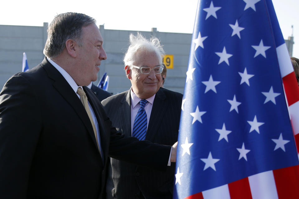 U.S. Secretary of State Mike Pompeo meets U.S. Ambassador to Israel David Friedman upon his arrival at Ben Gurion International Airport, near Tel Aviv, Israel, Wednesday, March 20, 2019. (Jim Young/Pool Image via AP)