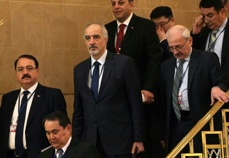 Syria's UN ambassador and head of the government delegation, Bashar al-Jaafari (C), Syrian ambassador to Russia, Riad Haddad (L), and delegation members arrive prior to the second session of Syria peace talks in Astana, on February 16, 2017