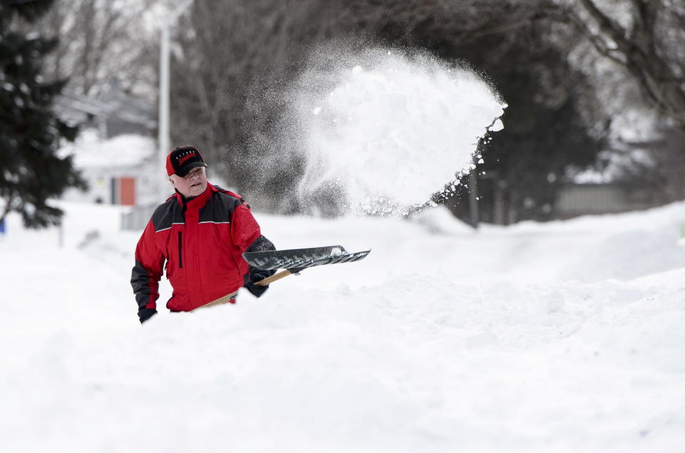 Jeff Maguire digs out his driveway in Carleton Place, Ontario on Monday, Jan. 21, 2019. (Sean Kilpatrick/The Canadian Press via AP)