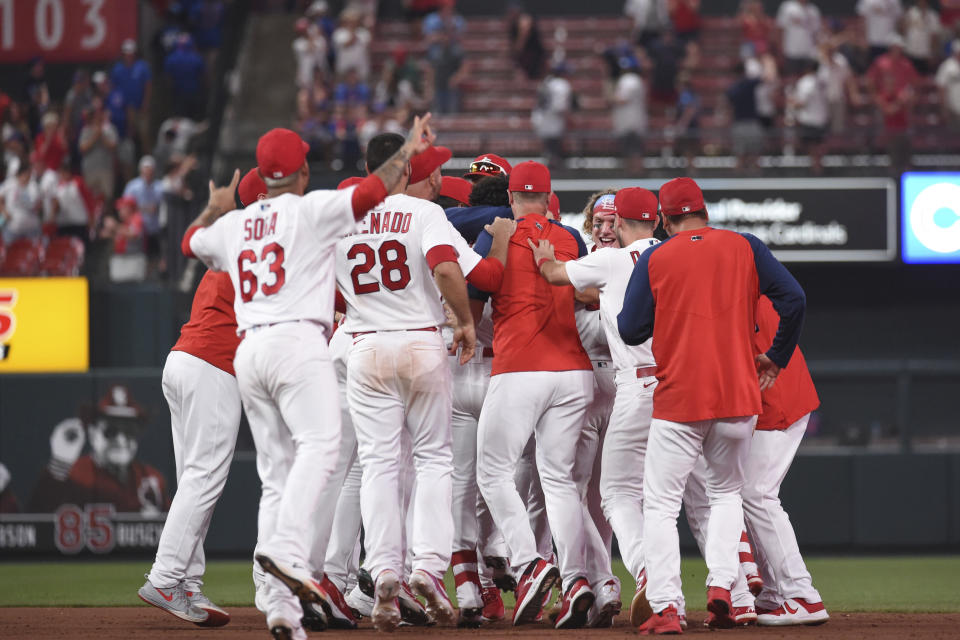 St. Louis Cardinals celebrate a 3-2 victory over the Chicago Cubs in a baseball game Wednesday, July 21, 2021, in St. Louis. (AP Photo/Joe Puetz)