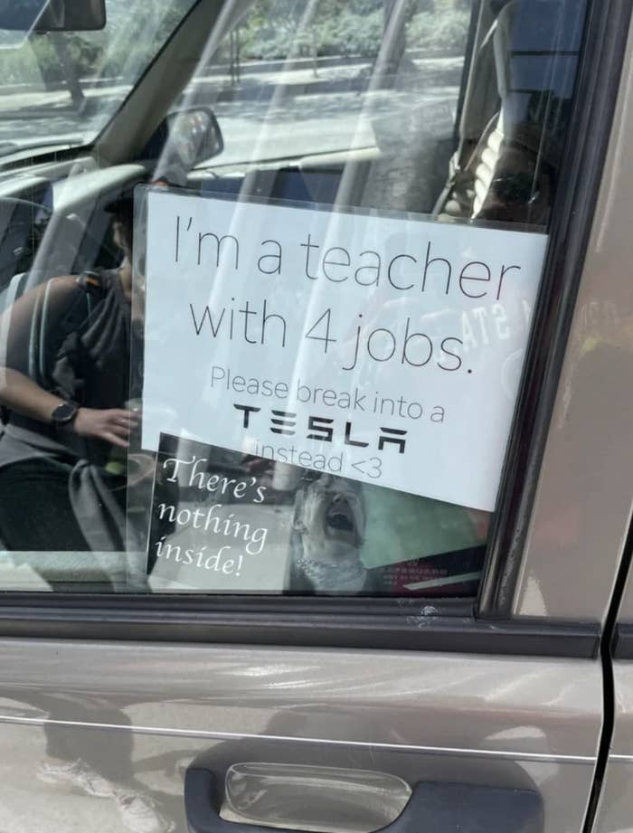 Car sign: I'm a teacher with 4 jobs; please break into a Tesla instead"