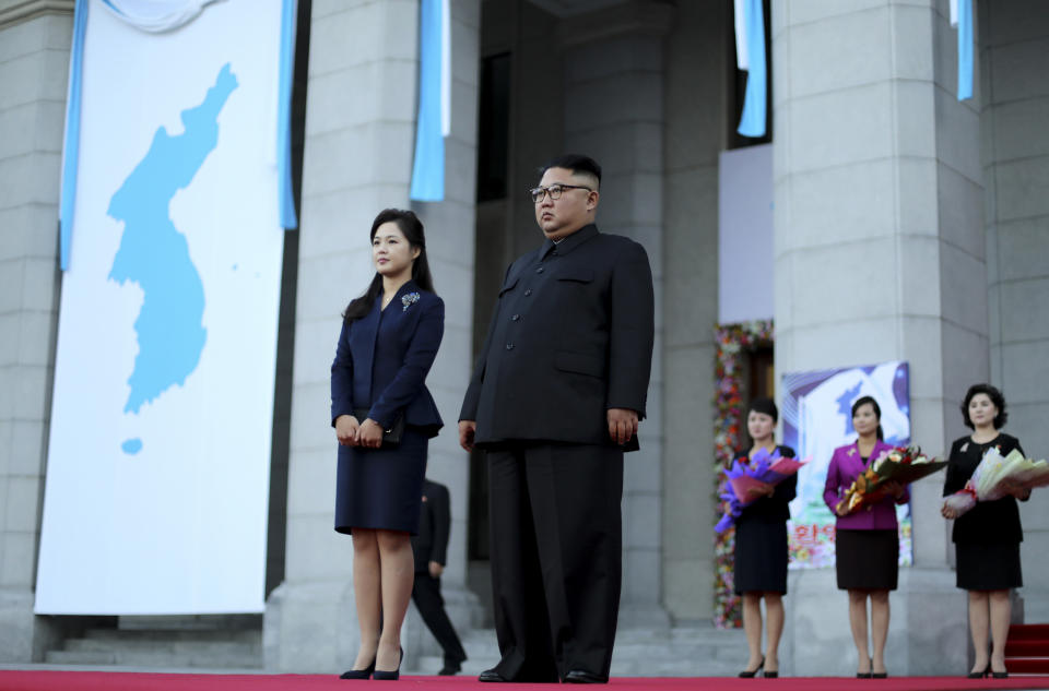 North Korean leader Kim Jong Un and his wife Ri Sol Ju wait for the arrival of South Korean President Moon Jae-in and his wife Kim Jung-sook at Pyongyang Grand Theatre in Pyongyang, North Korea, Tuesday, Sept. 18, 2018. President Moon Jae-in began his third summit with North Korean leader Kim Jong Un on Tuesday with possibly his hardest mission to date — brokering some kind of compromise to keep North Korea's talks with Washington from imploding and pushing ahead with his own plans to expand economic cooperation and bring a stable peace to the Korean Peninsula. (Pyongyang Press Corps Pool via AP)