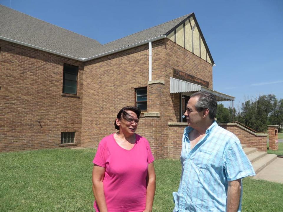 Dorothy Tobe and Mike Rosseau in front of the former church they’ve been remodeling as a home in St. John.