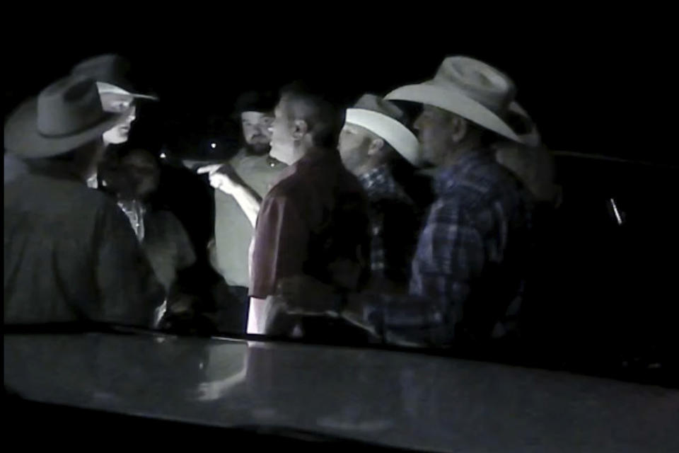 In this screen grab from body camera footage released by The Texas Department of Public Safety on Monday, Aug. 14, 2023, U.S. Rep. Ronny Jackson of Texas is seen arguing with officers outside a rodeo near Amarillo, Texas, in July. The video shows Jackson being taken to the ground by officers and profanely berating them. The congressman later said he was trying to help a person who needed medical care before officers intervened. (The Texas Department of Public Safety via AP)