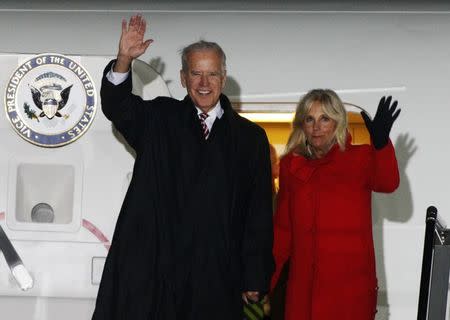 U.S. Vice President Joe Biden (L) and his wife Jill wave upon their arrival at Boryspil International airport outside Kiev November 20, 2014. REUTERS/Valentyn Ogirenko