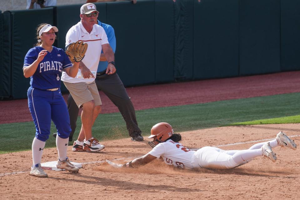 Texas' Vivi Martinez slides into third base during the Longhorns' win over Seton Hall on Friday. In Martinez's NCAA Tournament debut, the freshman went 2-for-2 with three RBIs and two runs scored.