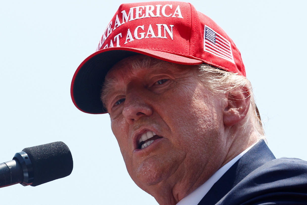 Former President Donald Trump at a rally in South Caroilna, wearing a Make America Great Again hat.