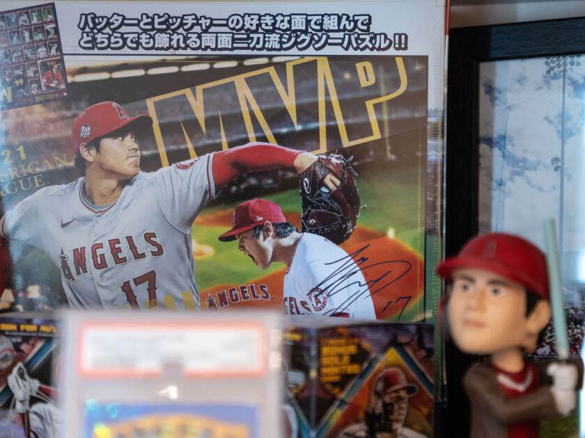 Baseball cards and bobbleheads of Shohei Ohtani.