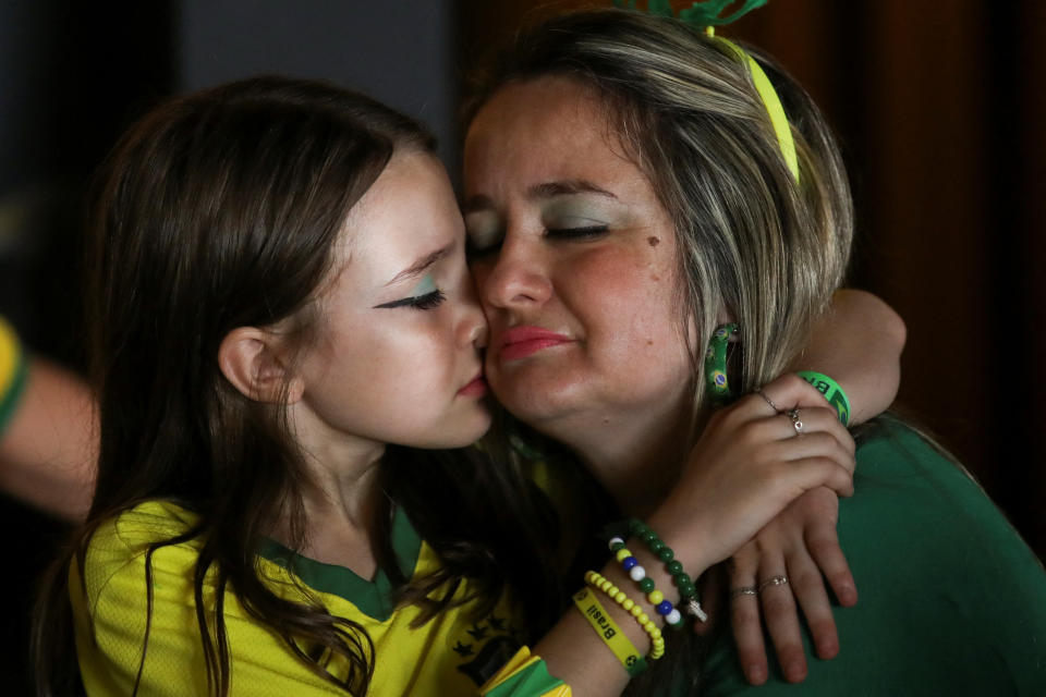 Brazilian fans react as they watch the FIFA World Cup Qatar 2022 match between Brazil and Croatia at a bar in Santos, Brazil, December 9, 2022. REUTERS/Carla Carniel