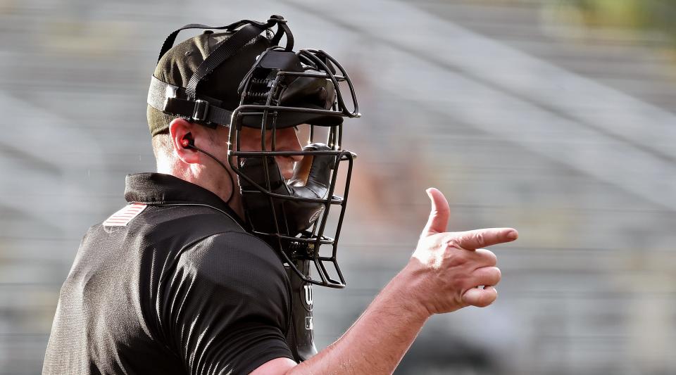 The Automated Ball-Strike technology (ABS) being used in AAA and A this season is likely to get adopted by MLB starting in 2024.
Here, home-plate umpire Nelson Fraley signals strike at Wednesday's Bradenton-Tampa game after getting the call from a computer.