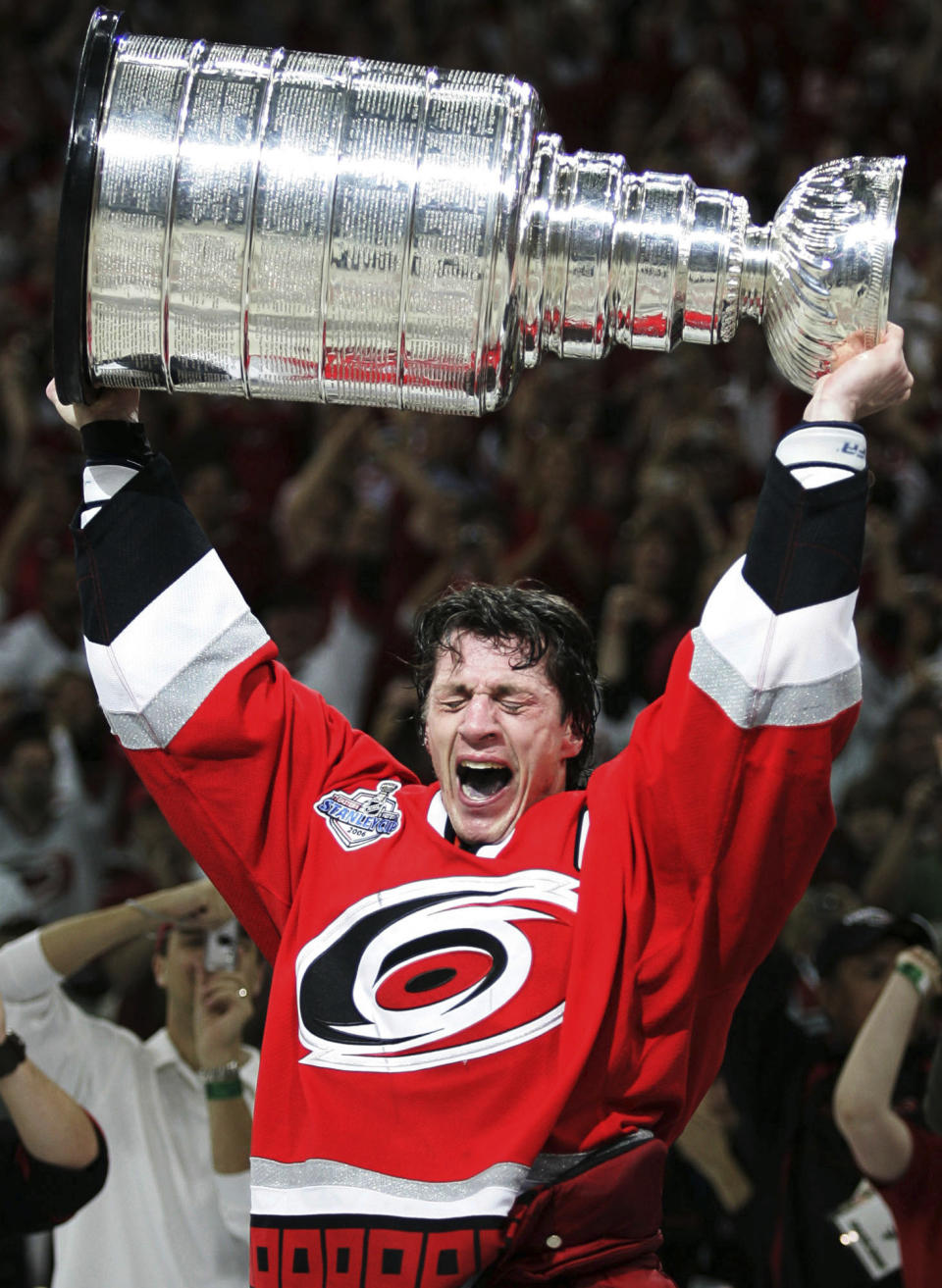 FILE - Carolina Hurricanes captain Rod Brind'Amour celebrates with the Stanley Cup after winning Game 7 of the Stanley Cup Finals over the Edmonton Oilers, in Raleigh, N.C., June 19, 2006. The 53-year-old Brind’Amour makes a habit of praising everyone around him when asked about the team's success, from players — including a core that has grown together through his tenure — to assistant coaches and support staff. Yet even as the captain of the Hurricanes’ 2006 Cup winner points elsewhere, there’s no minimizing Brind’Amour’s role in helping Carolina climb out of the wreckage of nine straight years without a single playoff game to become a perennial contender. (AP Photo/Ryan Remiorz, CP)