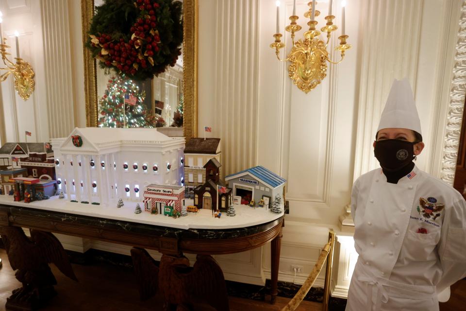 White House Pastry Chef Susan Morrison with the gingerbread White House.