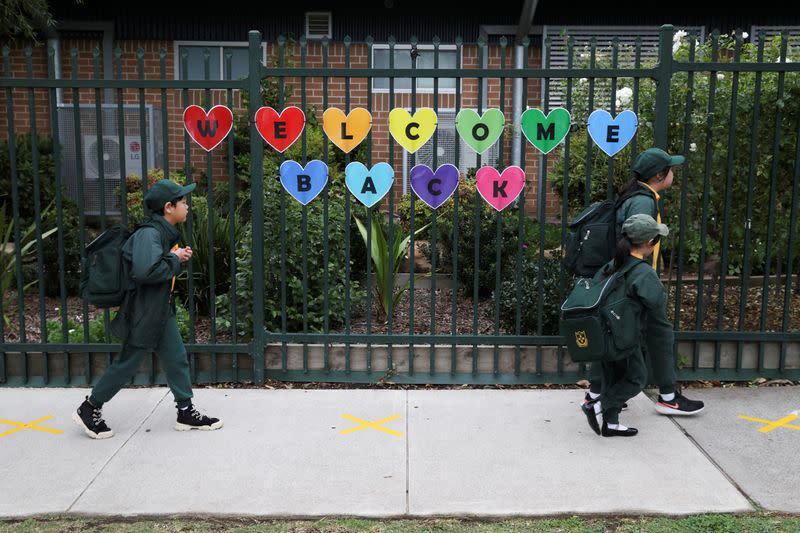 Children return to campus for the first day of New South Wales public schools fully re-opening in Sydney